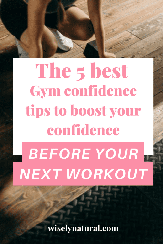 Women kneeling with dumbbells confident in her workout plan