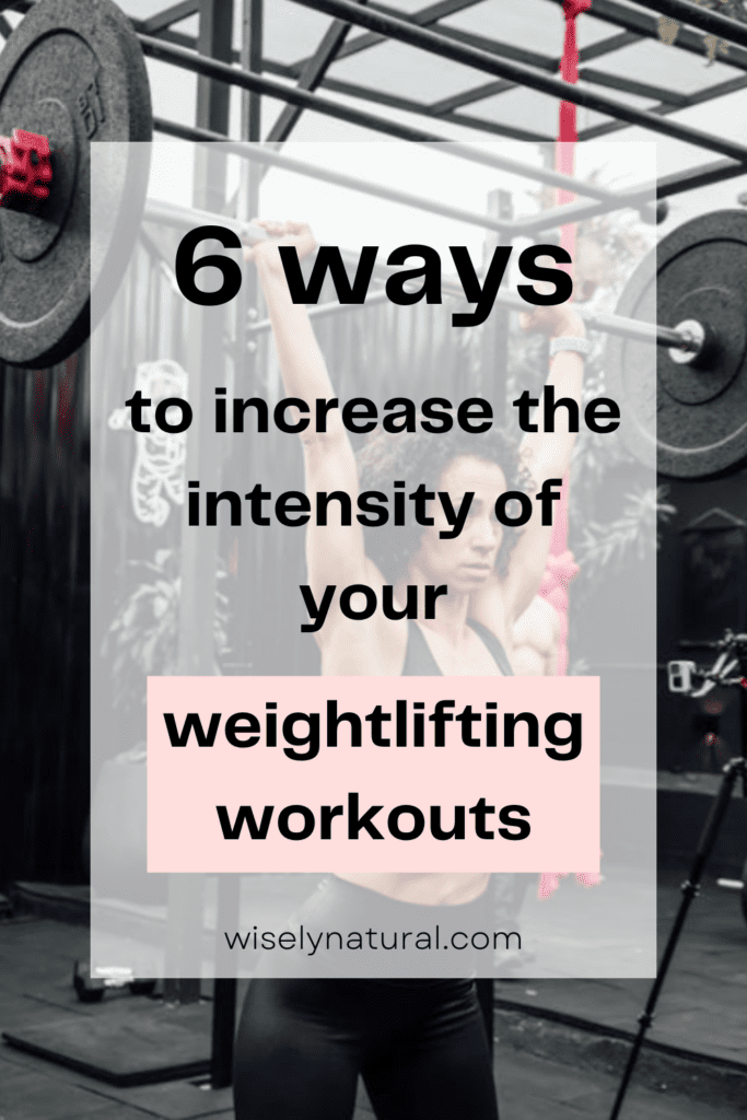 Woman lifting a barbell overhead in an outdoor gym
